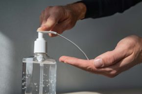 A man using Hand Sanitizer -Can Muslims Use Hand Sanitizers with Alcohol?