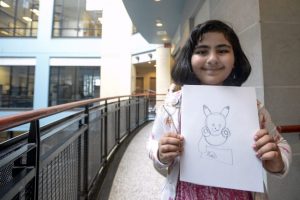Momina Khawaja, 8, shows off her favourite drawing of a Pokemon. (Andrew Lahodynskyj/Toronto Star) 