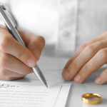 person signing marriage contract-Delaying Marriage in Islam