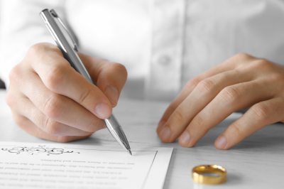 person signing marriage contract-Delaying Marriage in Islam