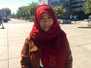 Nou Thao, 19, poses with her hijab. Fresno State’s Muslim Student Association challenged non-Muslims to cover their hair and see what a day in the life of a Muslim person is like. ANDREA CASTILLO