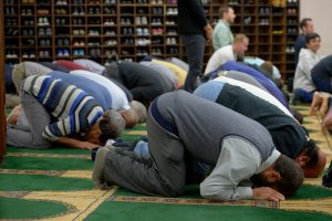 Men participate in prayer at the Islamic Center of Southern California's weekly prayer service. Photo by John McCoy/Los Angeles Daily News (SCNG)