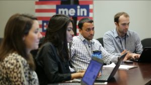 Zara Rahim, second from left, and Farooq Mitha, second from right, discuss Muslim outreach strategy in Hillary Clinton’s Brooklyn headquarters