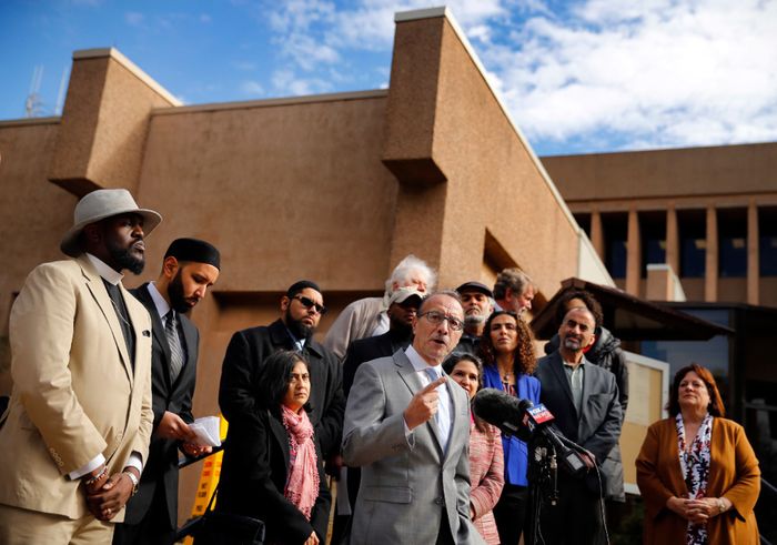  Immigration activist Carlos Quintanilla addresses a crowd outside Irving City Hall. (Tom Fox/Staff Photographer)