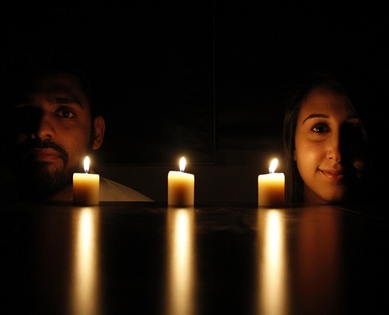 Imad Ahmad (left), Deah's best friend and roommate, and Lina Chaarawi, Yusor and Razan's cousin, pose in front of candles for each of Our Three Winners.