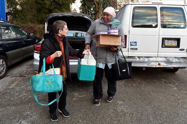 Sandy Choukroun (left) and Fatmata Sillah (right) with the Sisterhood of Salaam Shalom, deliver frozen kosher and halal meals at the Philadelphia Interfaith Hospitality Network in Mt. Airy February 15, 2017. For religious families who are hungry, it can be especially hard to find help in the form of healthy meals. The sisterhood brings together Jewish and Muslim women to cultivate community and understanding. TOM GRALISH / Staff Photographer