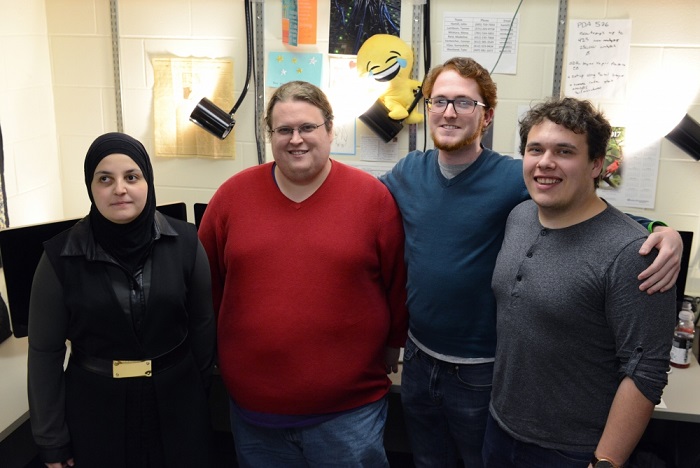 Mona Minkara poses for a portrait in Kolthoff Hall with her team on Tuesday, March 20, 2017. Minkara is the University's first blind, female, computational chemist. 