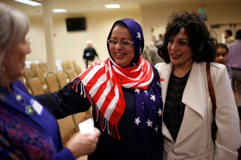 Sabuhi Siddique, center, chats with Rev. Nancy Palmer Jones, left, from First Unitarian Church of San Jose, and Samina Masood, at before the start of "Hands Around the Mosque" at the Muslim Community Association in Santa Clara, Calif. on Sunday, March 19, 2017. (Nhat V. Meyer/Bay Area News Group)
