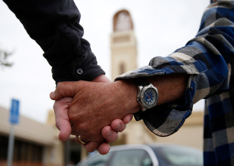 Participants hold hands for "Hands Around the Mosque" outside the Muslim Community Association in Santa Clara, Calif. on Sunday, March 19, 2017. (Nhat V. Meyer/Bay Area News Group)
