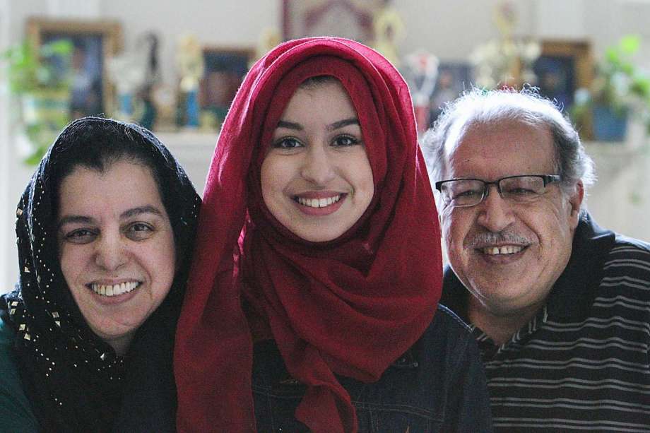 Amina Mabizari was taught to read by her mother, Nadia, left, while her father, Bachir, worked and attended the University of Texas at Austin.