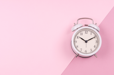white-retro-clock-on-pink-background-What Is the Waiting Period for Widows?