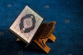 Copy of the Quran on a wooden stand