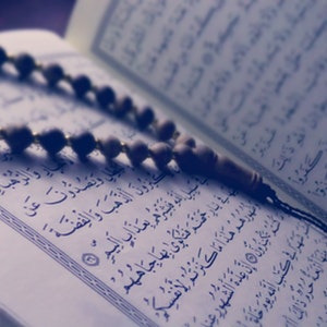 Can Menstruating Women Touch Books Containing Qur’anic Verses?