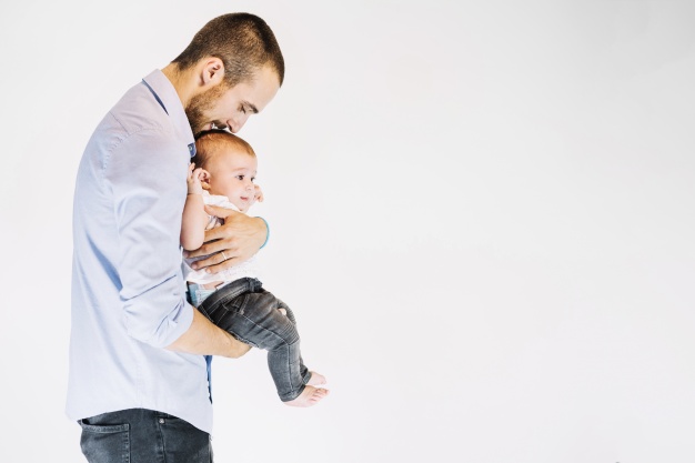 Father carrying his child-Can You Kiss Your Child on the Lips in Islam?