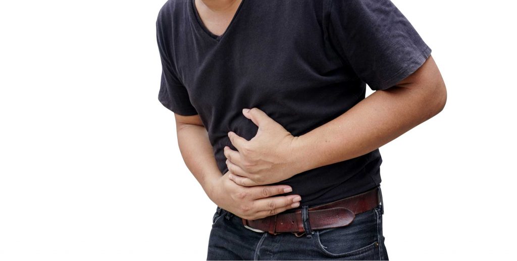 man suffering from stomachache