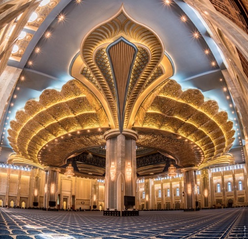 Grand Mosques in Kuwait: With its pleasant and relaxing beige exterior, this mosque doesn’t look nearly as impressive from the outside as it does from the inside, with its massive golden flower petals ceiling.