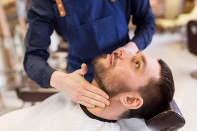 barber applying aftershave lotion-Is Alcohol in Aftershave Permissible in Islam?