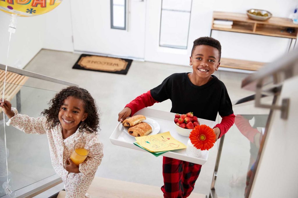 2 kids carrying food-Is It Haram to Serve Pork?