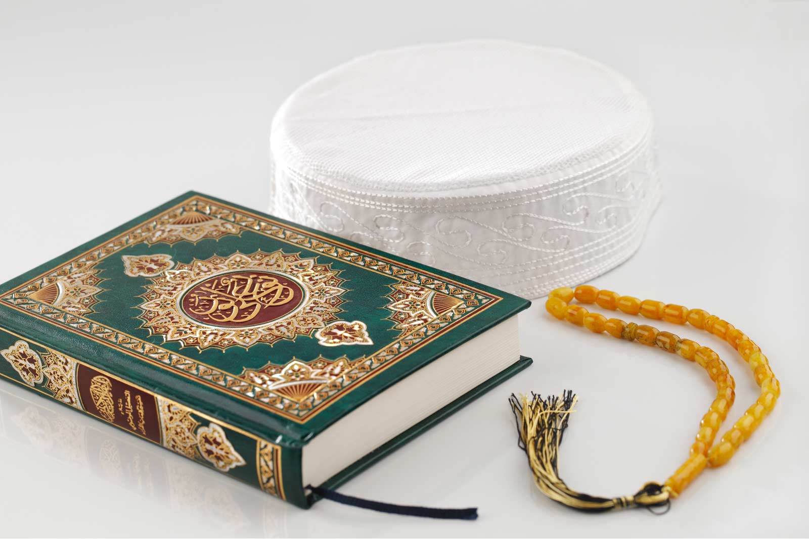 copy of quran and prayer beads