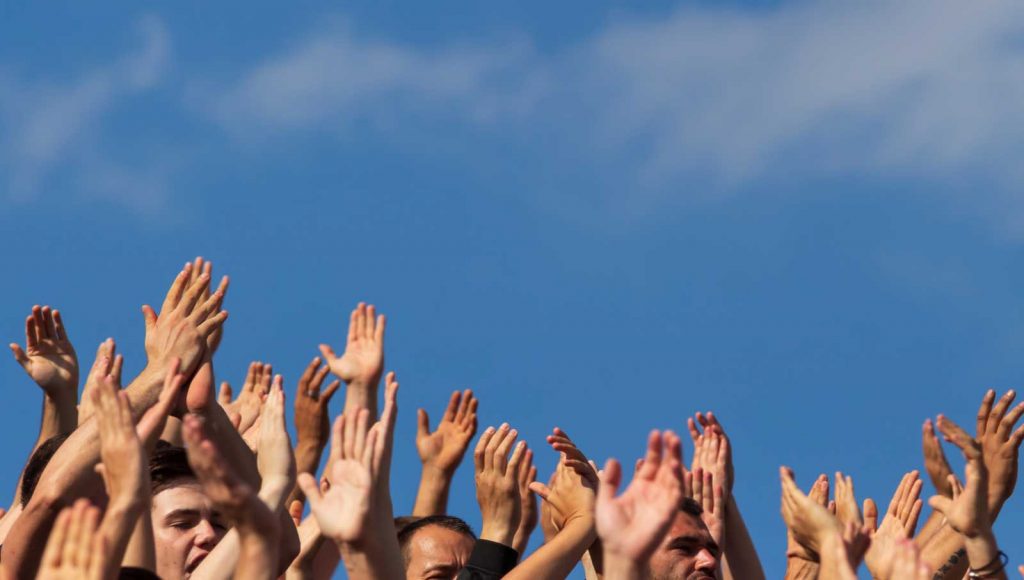 Hands raised up in the sky--Is Volunteering with Non-Muslims Permissible?