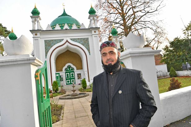 Imam Hashmi stands outside the main building (Image: Surrey Advertiser – Grahame Larter)