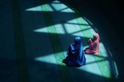 two muslim women making duaa