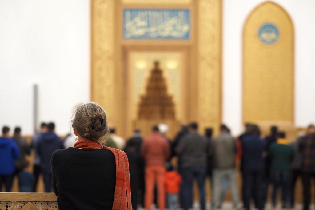 Cambridge-Mosque-Visitor-Watching-Men-Pray-Behind-Women’s-Barrier