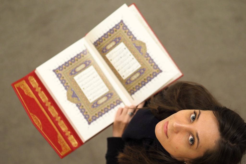 Tatiana-With-Quran-Opening-Pages