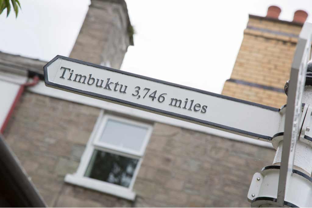 Timbuktu Destination Sign in Modern City