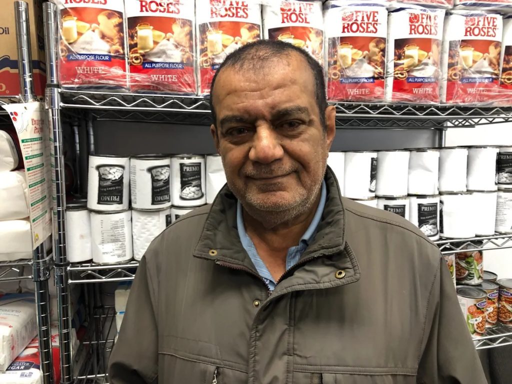 Gimil Khassim and his wife use the food bank at the Windsor Mosque. (Dale Molnar/CBC)