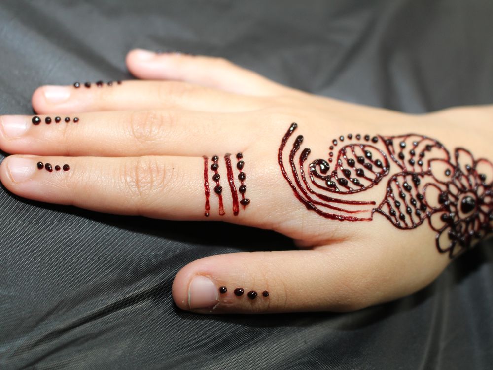 A woman shows off her henna tattoo at a community open house at the Markaz Ul Islam Mosque in Fort McMurray, Alta. on Saturday, January 25, 2020. Vincent McDermott/Fort McMurray Today/Postmedia Network