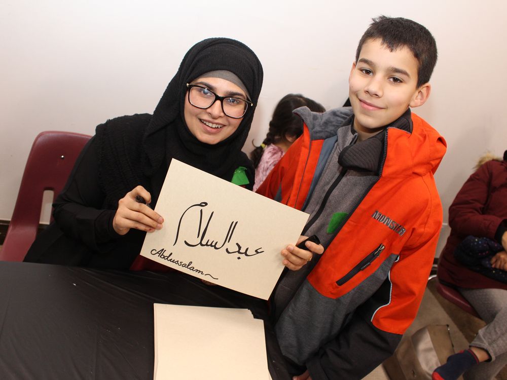Ambreen Ehtisham shows off Abdussalam Kabbara name written Arabic calligraphy at a community open house at the Markaz Ul Islam Mosque in Fort McMurray, Alta. on Saturday, January 25, 2020. Vincent McDermott/Fort McMurray Today/Postmedia Network