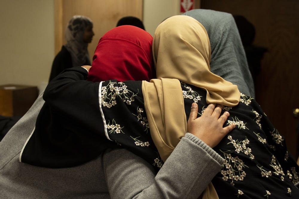 Attendees greet each other at the Muslim Alumni Association kickoff event at Masjid Al-Iman on Friday, Feb. 7.  Nur B. Adam