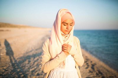 Muslim woman on the beach spiritual portrait
