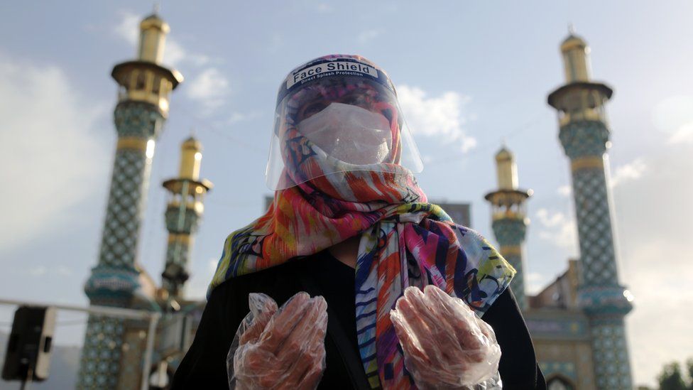 People wore protective gloves and masks and maintained social distancing in Tehran