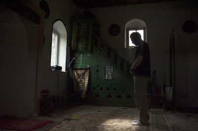 A Muslim in standing position in prayerdark