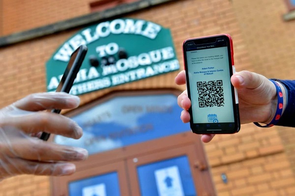 Worshippers are asked to pre-book their prayer time and a barcode is scanned before entry is allowed