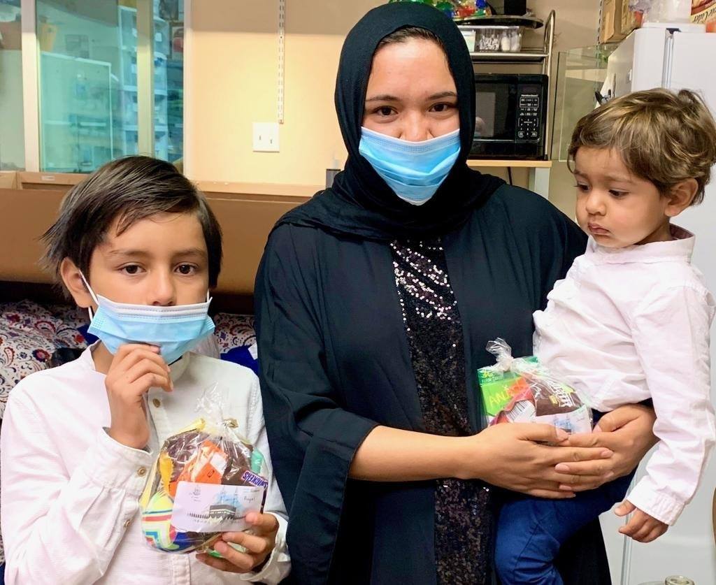 Muslim mother and her two kids participating in the online event