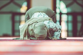 A Muslim woman in prostration position-What Happens If Your Hijab Falls Off during Prayer?