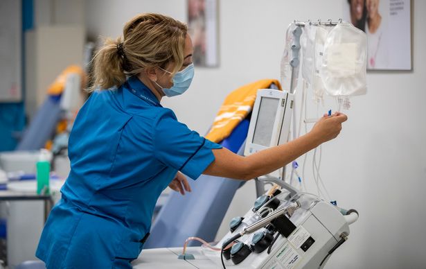 A member of the NHS Liverpool Blood and Transplant staff inside a pop-up plasma donor centre (Image: PA)