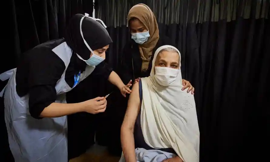 East London resident Khoyrun Nessa, 76, receives her Covid-19 vaccination at the pop-up vaccination centre. Photograph: David Levene/The Guardian