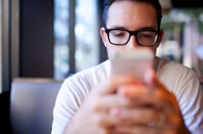 A Man Watching something on his mobile