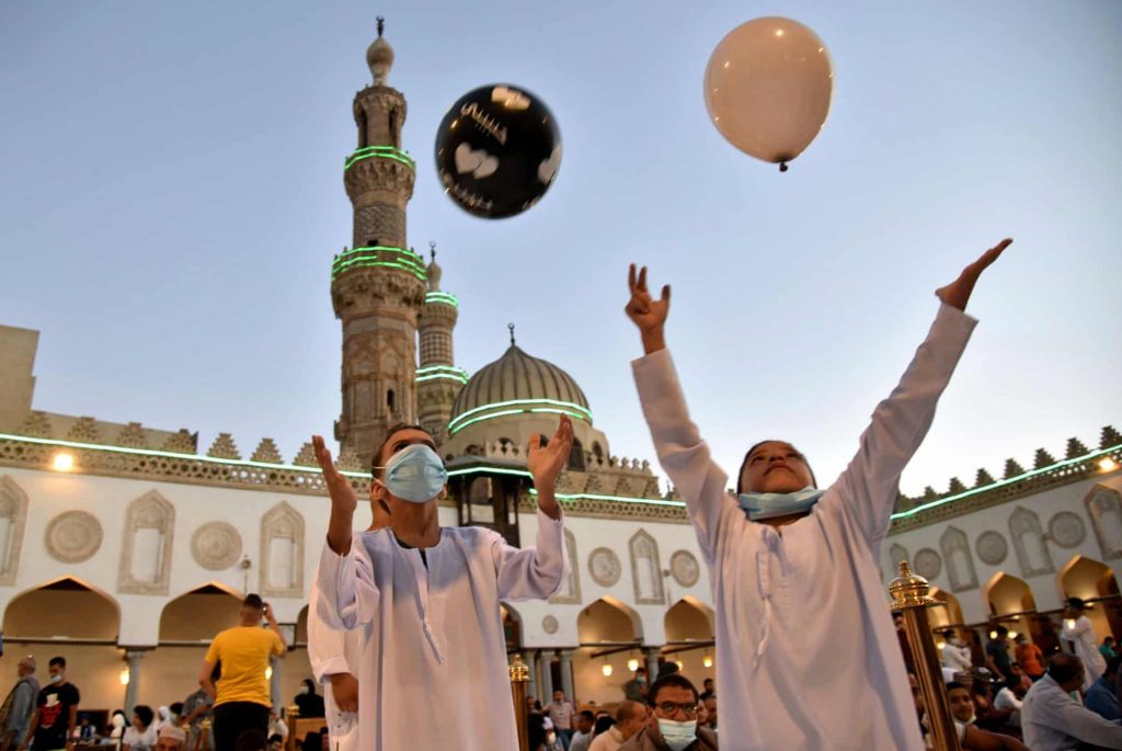 Kids play with balloons after Eid al-Adha prayer inside al-Azhar Mosque in Cairo, EgyptPhotograph: Mohamed Abd El Ghany/Reuters