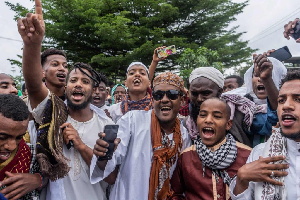 Muslim worshippers sing songs during to the Eid al-Adha prayers on the first day of the feast, at Millennium Square in Hawassa, EthiopiaPhotograph: Amanuel Sileshi/AFP/Getty Images