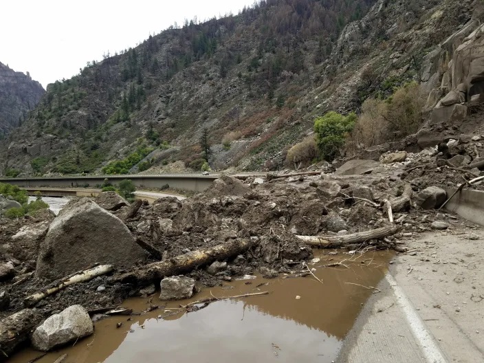 This image provided by the Colorado Department of Transportation shows mud and debris on U.S. Highway 6, Sunday, Aug. 1, 2021 west of Silver Plume, Colo. (Colorado Department of Transportation via AP)