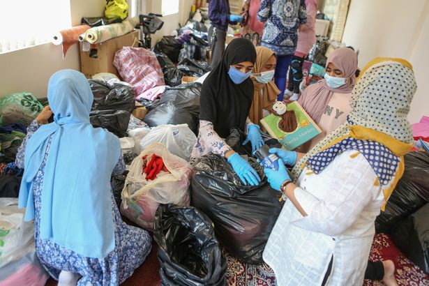 Locals help organise the donations (Image: Lincolnshire Echo/James Turner)