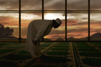 A Muslim in bowing position during prayer