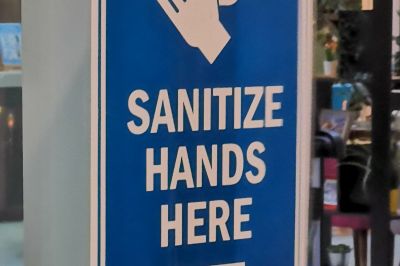 Can I offer prayers in clothes after walking through automatic sanitization gates?