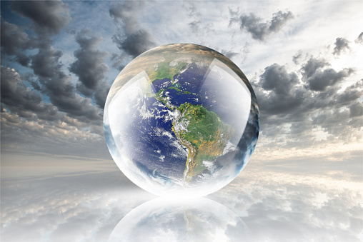 Crystal ball reflecting globe of the earth on clouds background
https://upload.wikimedia.org/wikipedia/commons/d/db/Nasa_blue_marble.jpg
