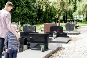 father with kid visiting grave-Can a Muslim Visit a Non-Muslim Grave?